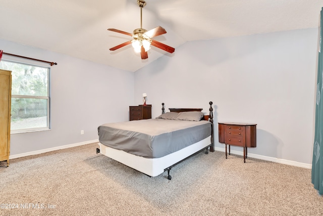 bedroom featuring ceiling fan, carpet, and lofted ceiling