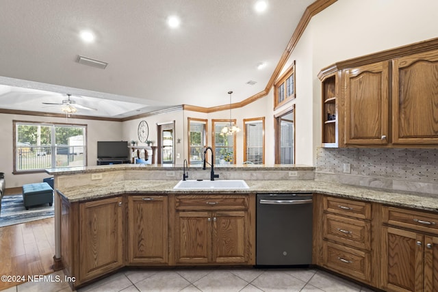 kitchen featuring light stone counters, stainless steel dishwasher, ornamental molding, sink, and light hardwood / wood-style flooring