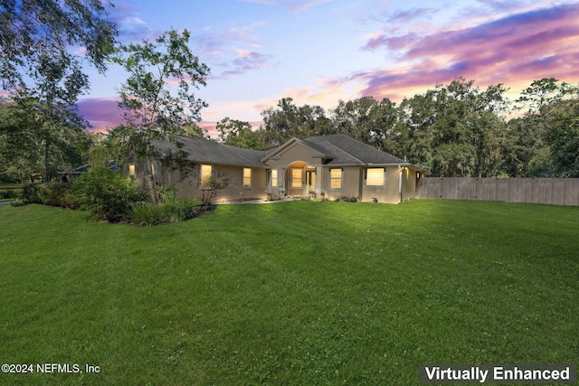 prairie-style house featuring a lawn