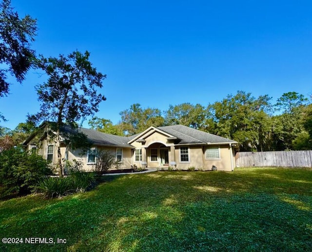 view of front of home with a front lawn