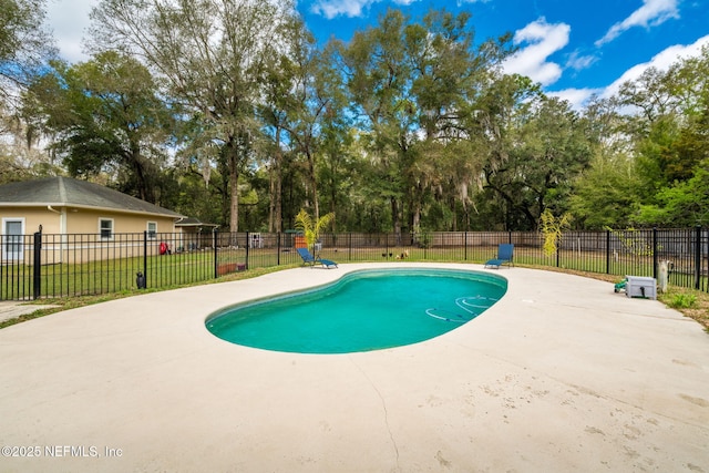 view of swimming pool with a patio area, fence, and a fenced in pool