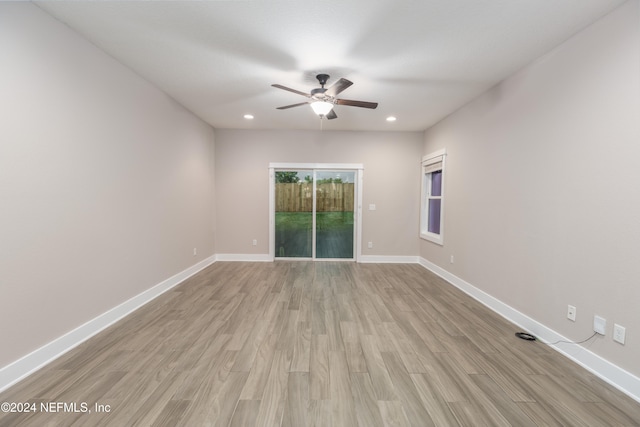 unfurnished room featuring ceiling fan and light wood-type flooring