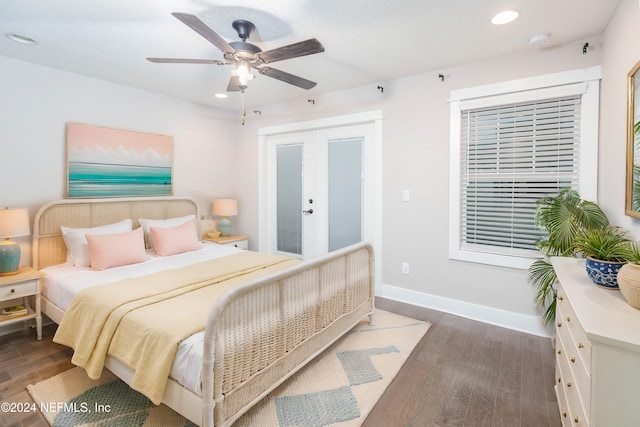 bedroom with dark wood-type flooring, ceiling fan, and french doors