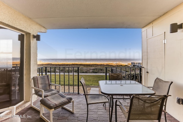 balcony featuring a water view