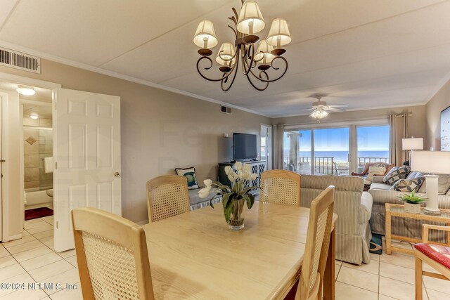 3350 S Fletcher Ave Unit J1, Fernandina Beach, FL 32034 - dining room featuring crown molding, light tile patterned floors, visible vents, and ceiling fan with notable chandelier