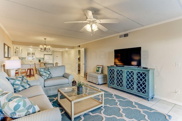 3350 S Fletcher Ave Unit J1, Fernandina Beach, FL 32034 - living area featuring ceiling fan with notable chandelier, visible vents, crown molding, light tile patterned floors, and baseboards