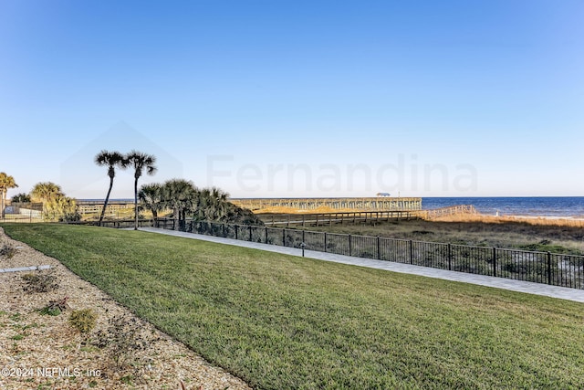3350 S Fletcher Ave Unit J1, Fernandina Beach, FL 32034 - view of community with fence, a water view, and a lawn