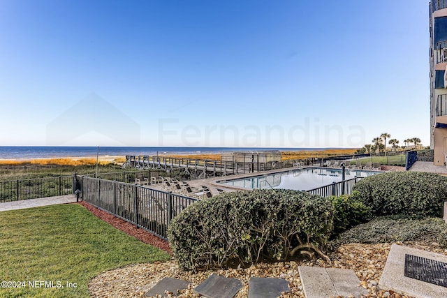 3350 S Fletcher Ave Unit J1, Fernandina Beach, FL 32034 - pool with a yard, a water view, and fence