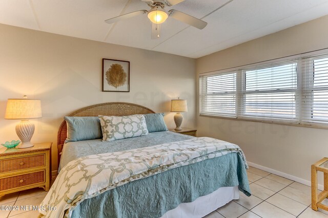 3350 S Fletcher Ave Unit J1, Fernandina Beach, FL 32034 - bedroom featuring light tile patterned floors, baseboards, ceiling fan, and lofted ceiling