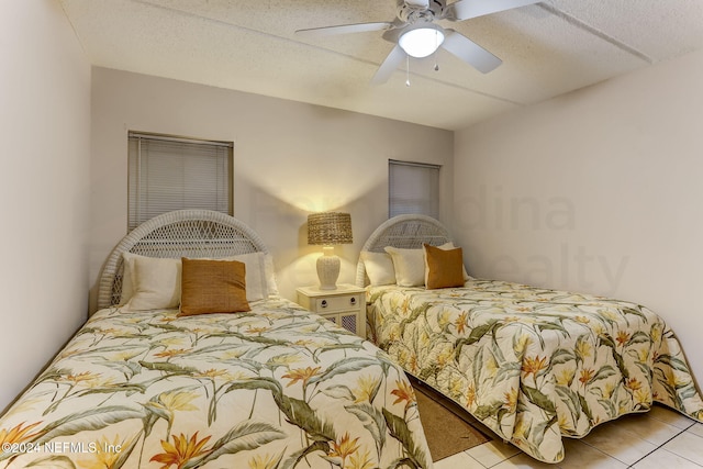 3350 S Fletcher Ave Unit J1, Fernandina Beach, FL 32034 - bedroom featuring ceiling fan and tile patterned floors