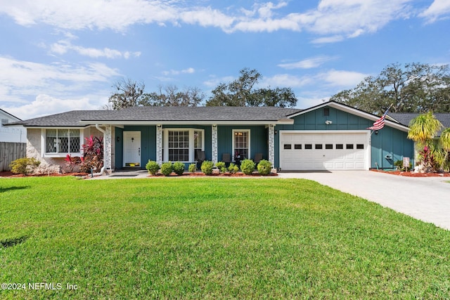 single story home featuring a garage and a front lawn