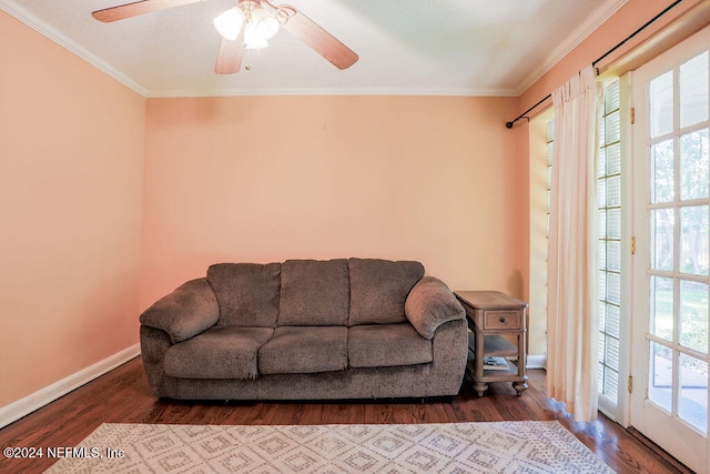 living room featuring ornamental molding, hardwood / wood-style flooring, and plenty of natural light