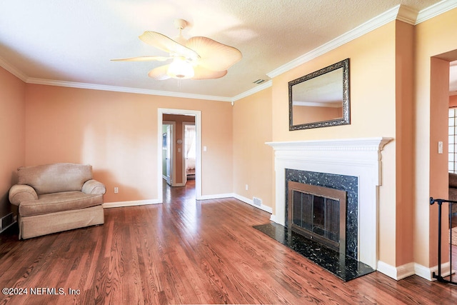 living area featuring crown molding, wood-type flooring, and a high end fireplace