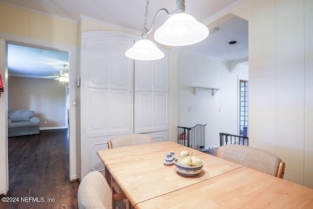 dining area featuring ornamental molding, dark hardwood / wood-style floors, and ceiling fan