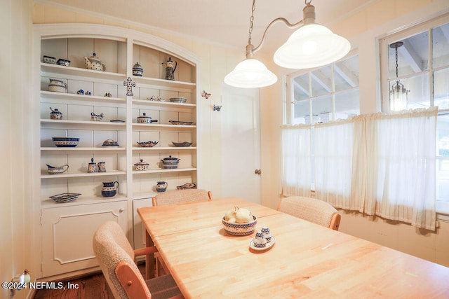 dining room featuring crown molding