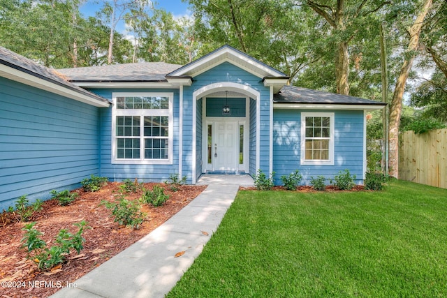 view of front of property with a front lawn