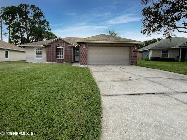 ranch-style home featuring a garage and a front lawn