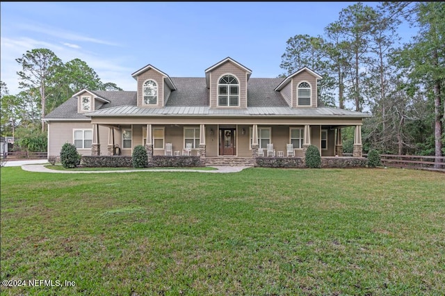 1315 Whispering Pines Rd, Saint Johns, FL 32259 - view of front facade featuring a standing seam roof, covered porch, metal roof, and a shingled roof