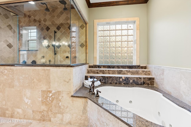 bathroom featuring crown molding and shower with separate bathtub