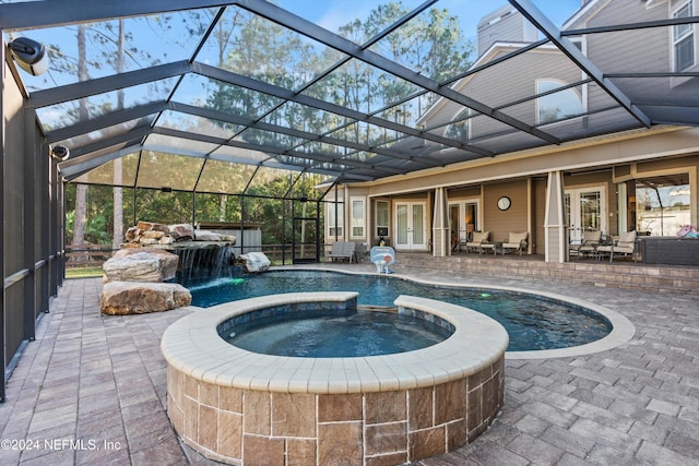 view of swimming pool with an in ground hot tub, french doors, a lanai, pool water feature, and a patio area