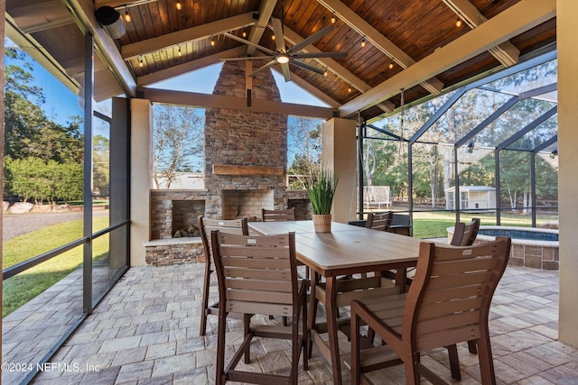 1315 Whispering Pines Rd, Saint Johns, FL 32259 - sunroom featuring an outdoor stone fireplace, ceiling fan, and outdoor dining space