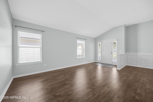 entryway featuring lofted ceiling and dark hardwood / wood-style floors