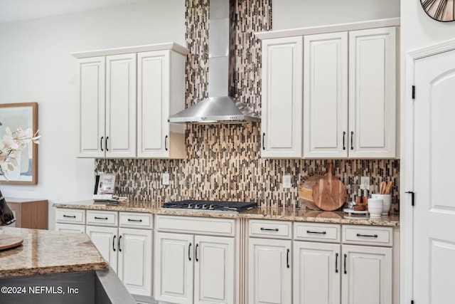 kitchen featuring white cabinetry, stainless steel gas cooktop, and tasteful backsplash