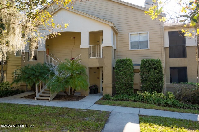 21 Arbor Club Dr Unit 101, Ponte Vedra Beach, FL 32082 - townhome / multi-family property with a chimney and stairs
