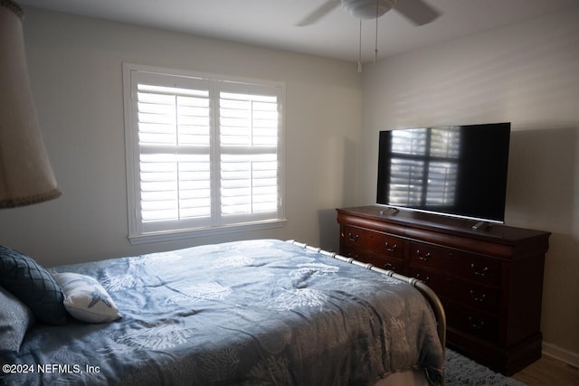 bedroom featuring wood-type flooring and ceiling fan