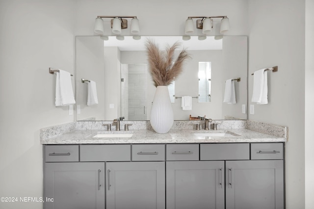 bathroom featuring vanity and a shower