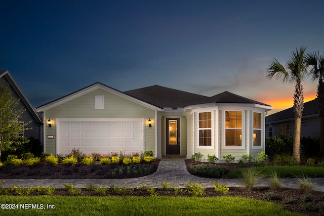 single story home with a garage