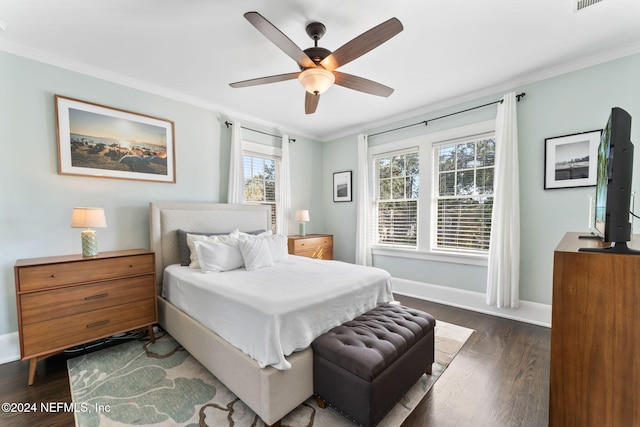 bedroom with ornamental molding, dark wood-type flooring, and ceiling fan