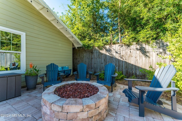 view of patio / terrace featuring a fire pit