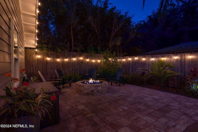 patio at twilight with a fire pit