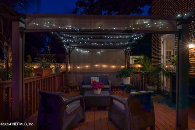 deck at twilight featuring an outdoor hangout area and a pergola