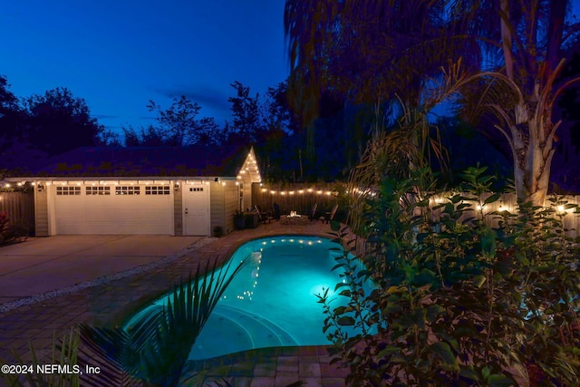 view of pool at night