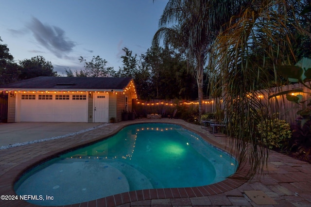 view of pool at dusk