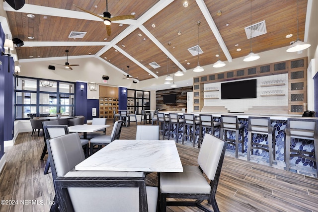 dining room featuring beam ceiling, ceiling fan, high vaulted ceiling, wood-type flooring, and wooden ceiling