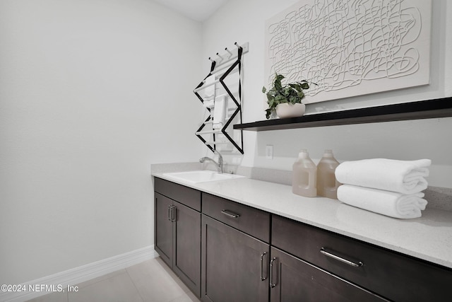 interior space with vanity and tile patterned flooring