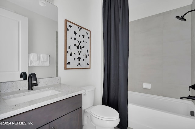 full bathroom featuring vanity, shower / bathtub combination with curtain, and toilet