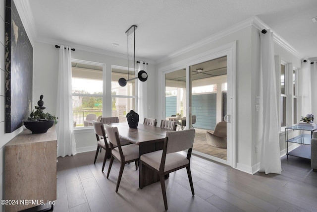 dining room with hardwood / wood-style flooring and ornamental molding