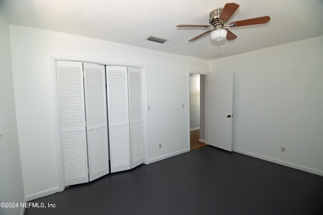 unfurnished bedroom with a closet, ceiling fan, and a textured ceiling