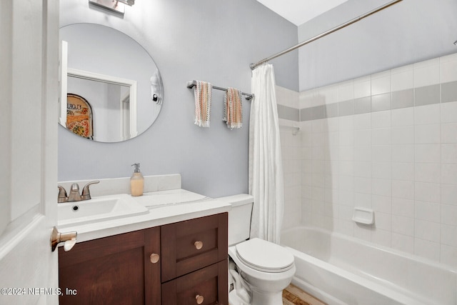 full bathroom with shower / bath combination with curtain, toilet, and vanity