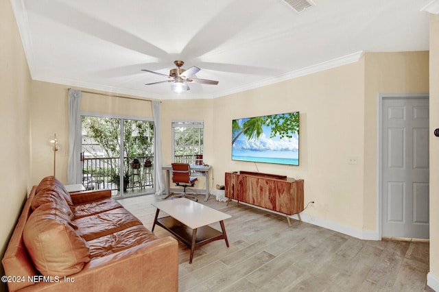 living area featuring ornamental molding, baseboards, visible vents, and light wood finished floors