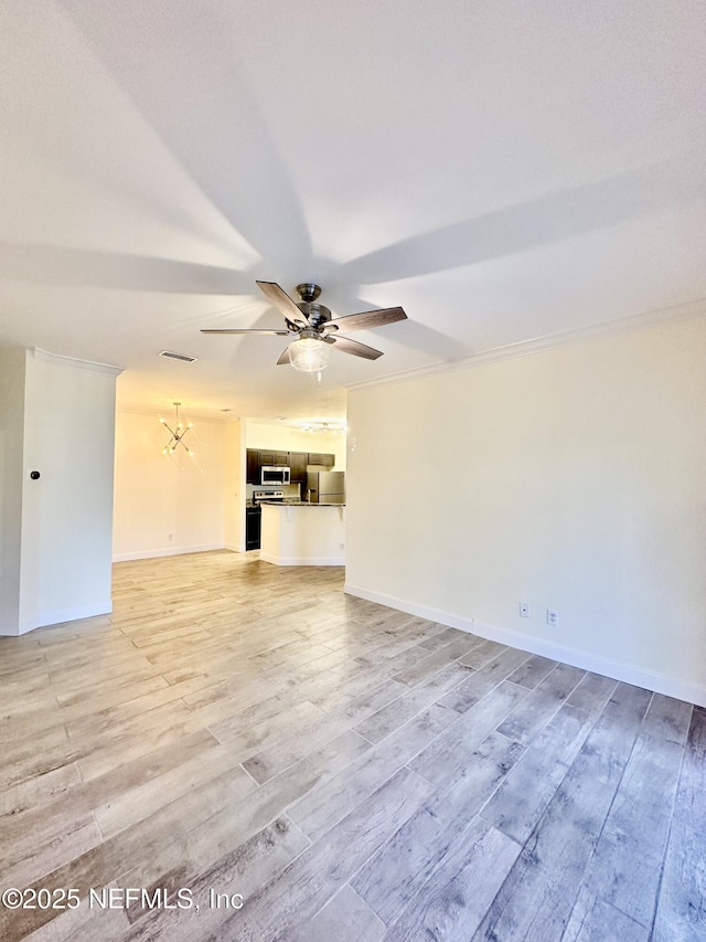 unfurnished living room with a ceiling fan, visible vents, light wood-style flooring, and baseboards