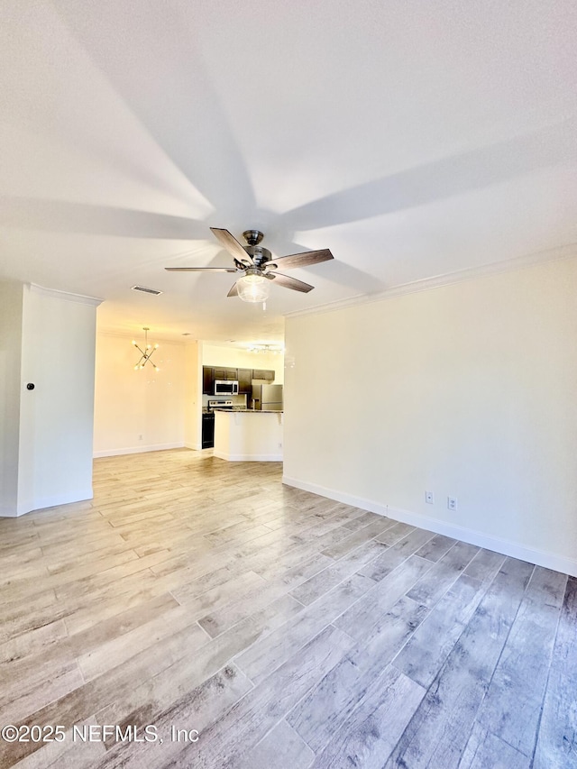 unfurnished living room featuring a ceiling fan, visible vents, light wood-style flooring, and baseboards