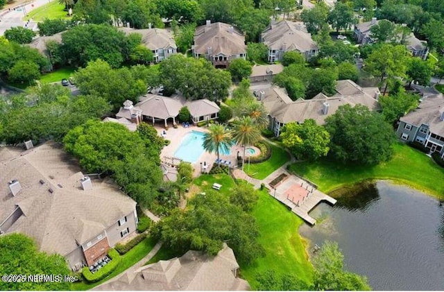 birds eye view of property featuring a water view and a residential view