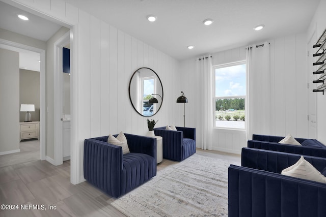 living room featuring wood walls