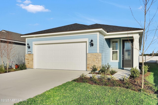 view of front of house featuring a garage, stone siding, concrete driveway, and a shingled roof