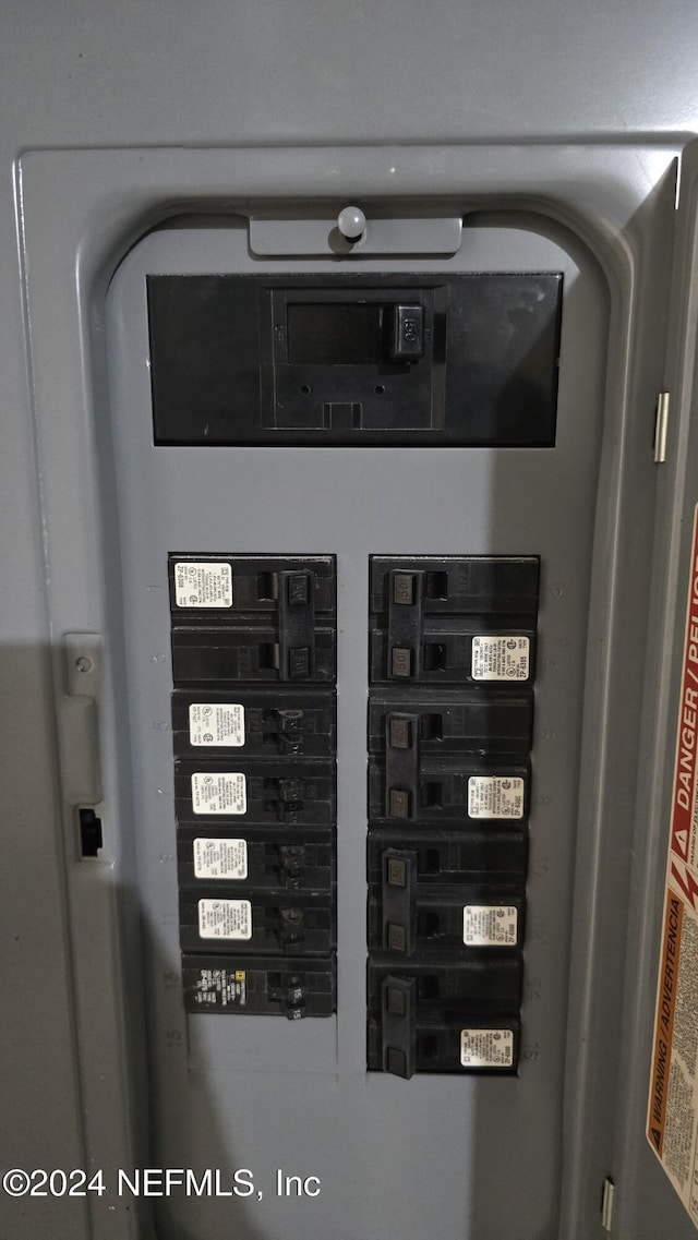 utility room featuring electric panel